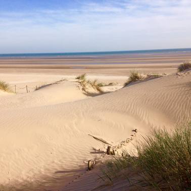 Camber Sands dunes and beach are a short walk from Marsh View Cottage