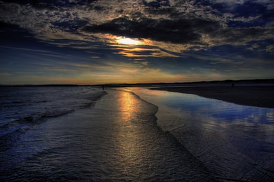 Beautiful sunsets over Camber Sands a short walk from our seaside holiday cottage in East Sussex